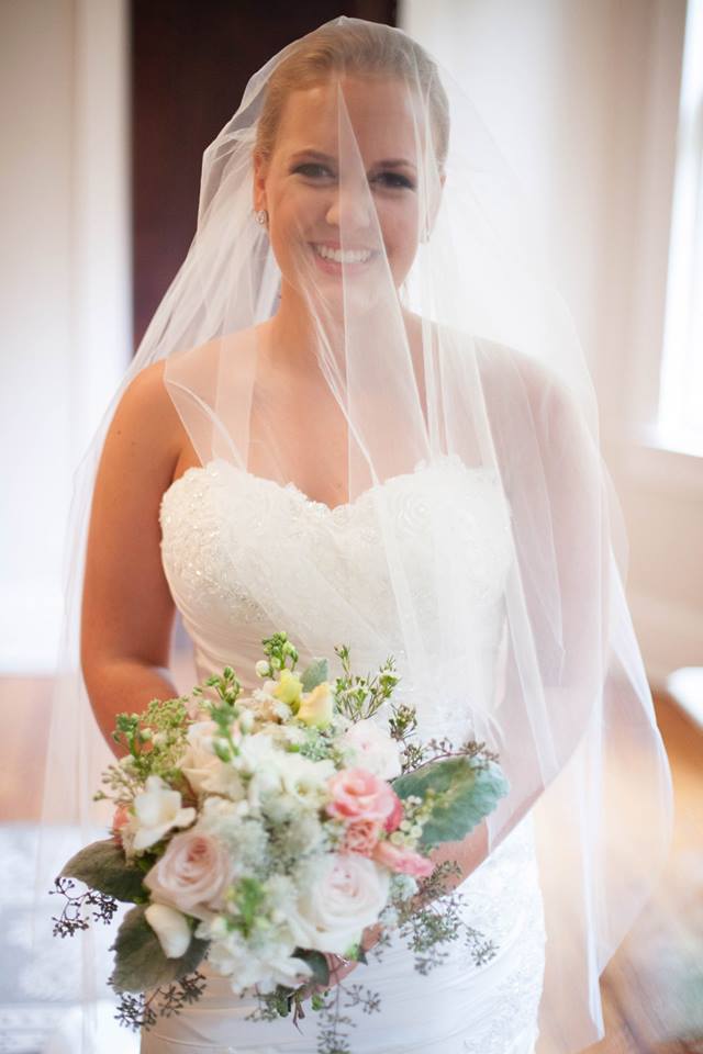 sister's wedding hot pink blue citrus summer wedding bride bouquet veil over face Tucker house Raleigh