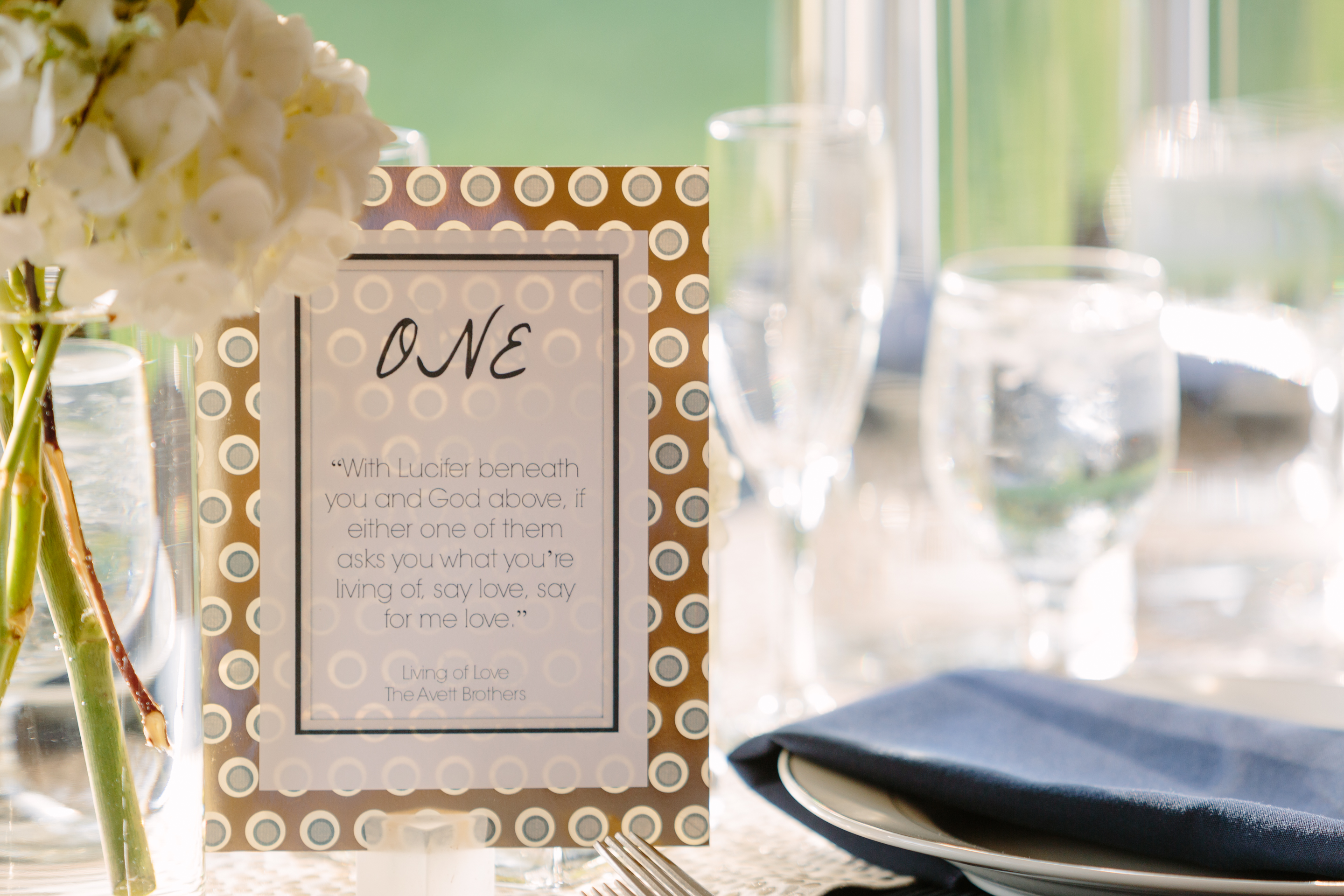 custom made table numbers with avett brothers song titles quotes white hydrangea and navy linen napkins