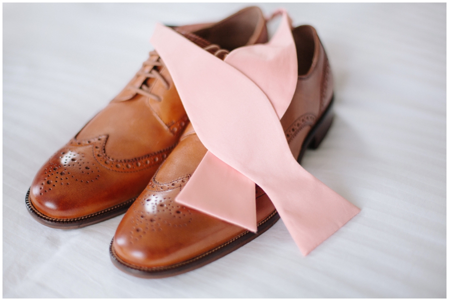 groom's accessories- pink bowtie and brown shoes